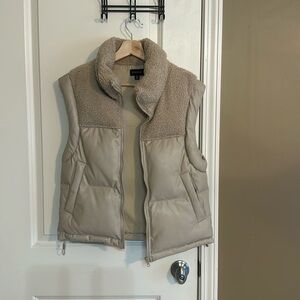 Tan puffer vest with faux sherling lapel. Size XS